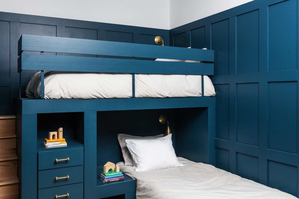 built in bunk beds with stairs and kids toys and books