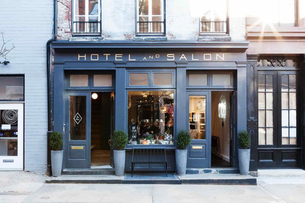 The historic front facade completely refurbished by Lokal Hotel Old City with mahogany and non-laquered brass finishes and hand lettered signage