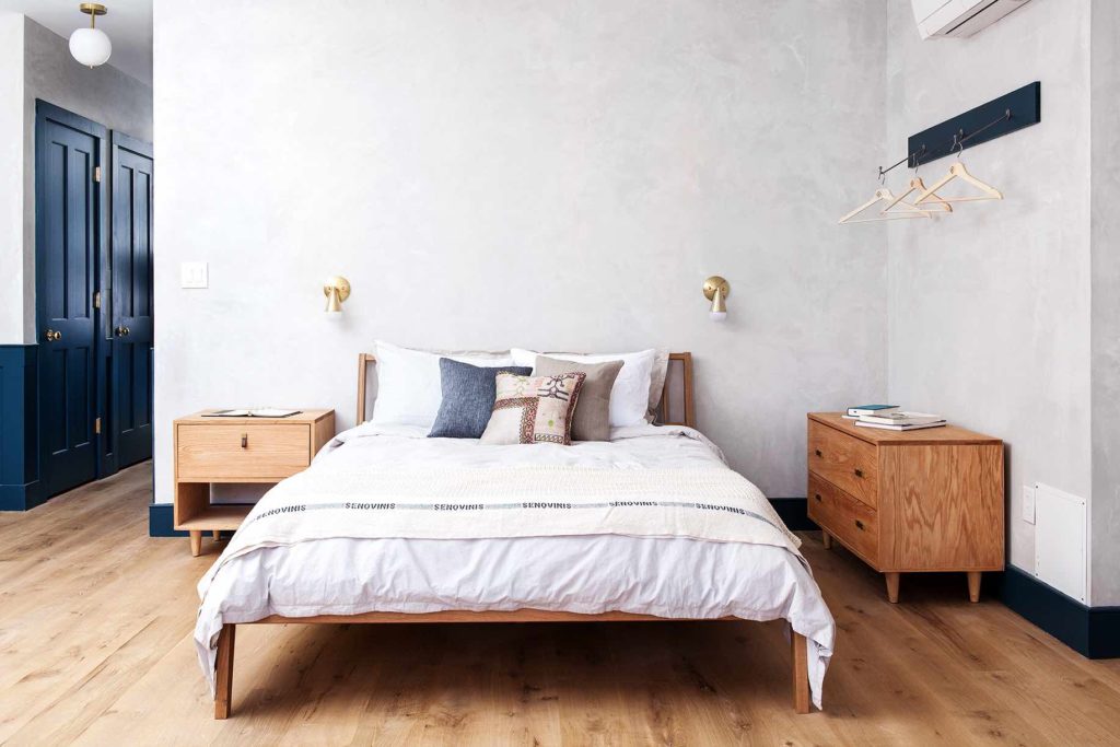 Cozy queen bed with casper mattress and parachute home sheets in apartment style hotel room in old city philadelphia