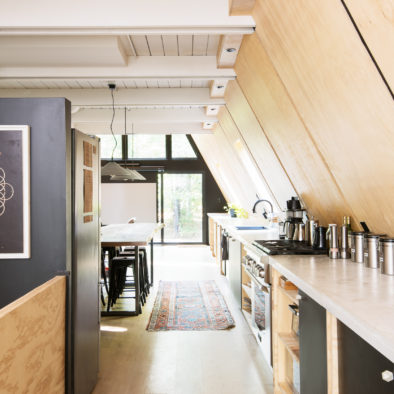 View of the interior of the Lokal Aframe with 40' long concrete countertop